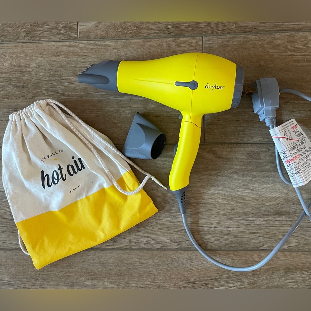DryBar buttercup travel blow dryer. Used gently.